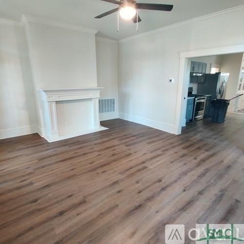 unfurnished living room with dark hardwood / wood-style flooring, ornamental molding, and ceiling fan