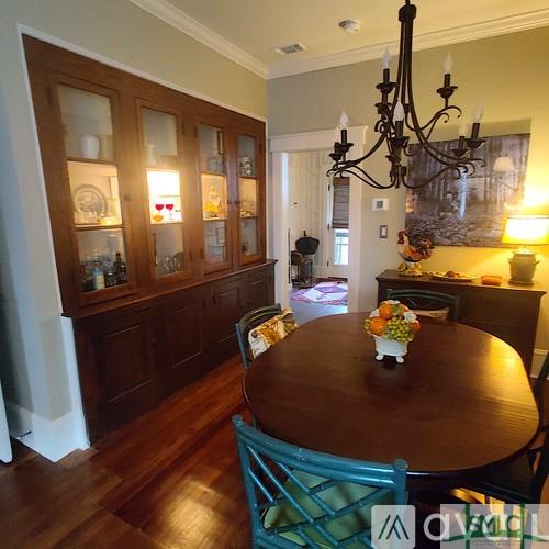 dining room featuring ornamental molding, dark hardwood / wood-style floors, and a chandelier