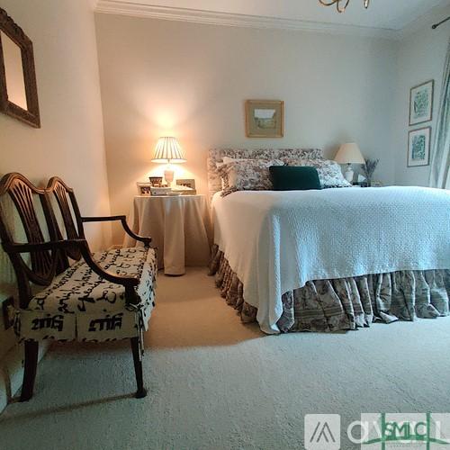 bedroom with crown molding and carpet floors