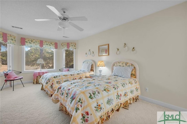 carpeted bedroom featuring ceiling fan