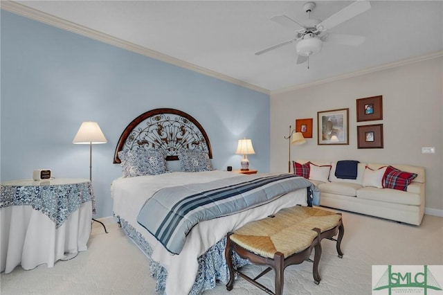 carpeted bedroom featuring ceiling fan and ornamental molding