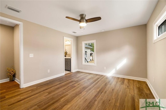 unfurnished room with wood-type flooring and ceiling fan