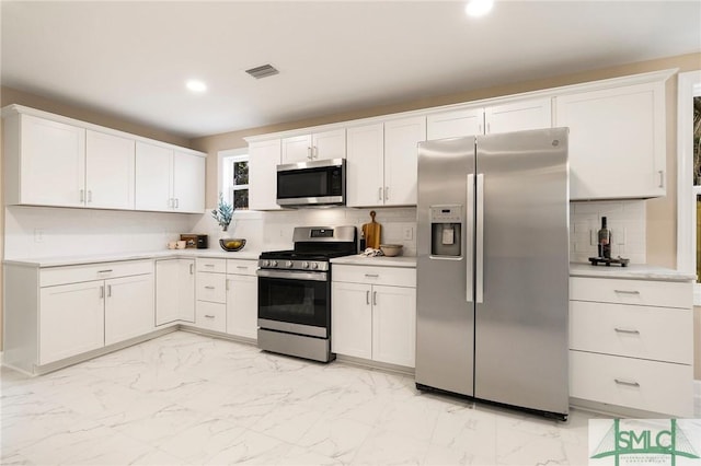 kitchen with white cabinetry and appliances with stainless steel finishes