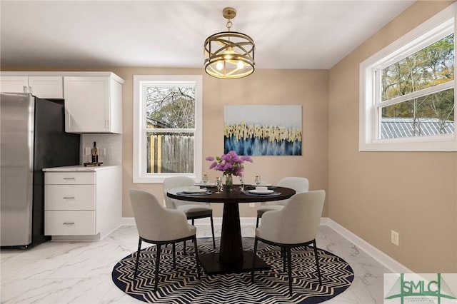 dining space with a chandelier