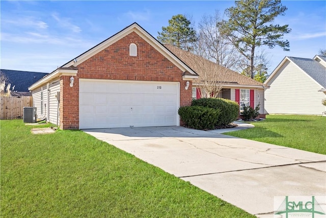 view of front of home with a garage, central AC, and a front yard