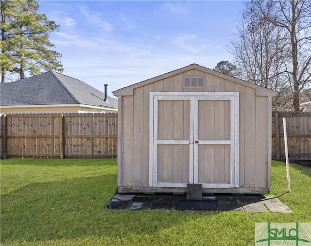 view of outbuilding with a lawn