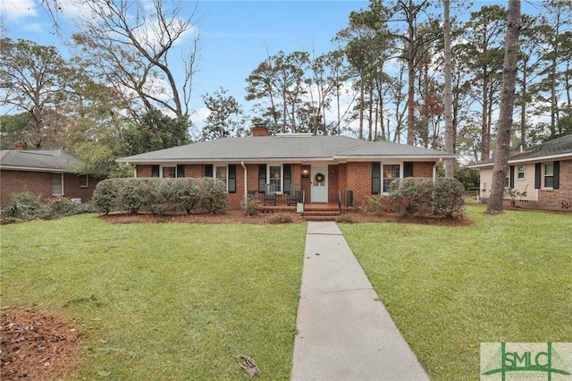 ranch-style house with a porch and a front lawn