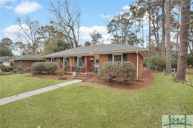 ranch-style home with a porch and a front lawn