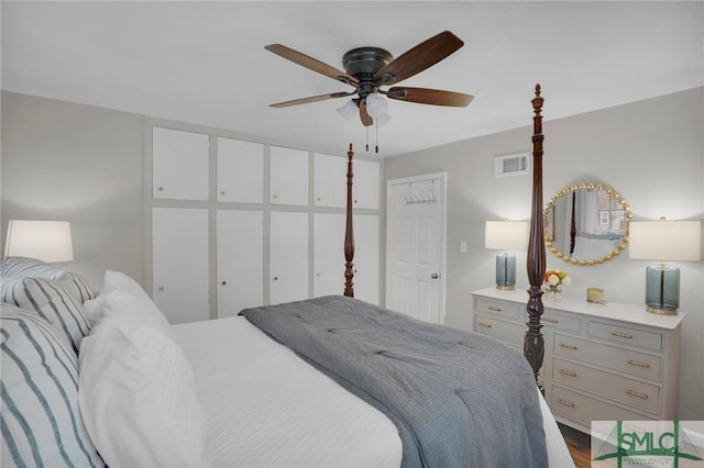 bedroom with hardwood / wood-style flooring and ceiling fan