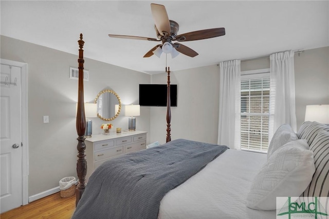 bedroom featuring ceiling fan and light wood-type flooring