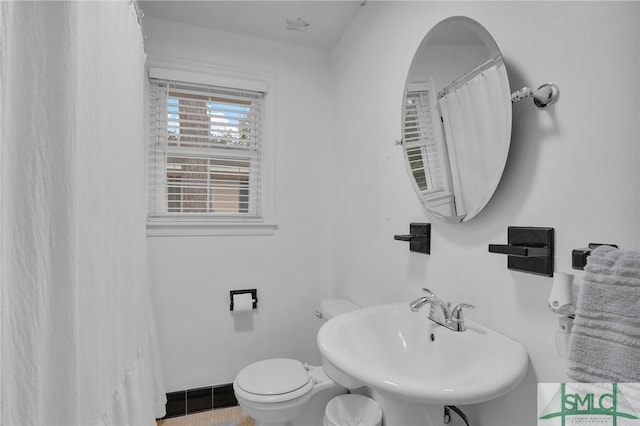 bathroom featuring sink and toilet