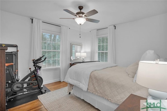 bedroom featuring hardwood / wood-style flooring and ceiling fan