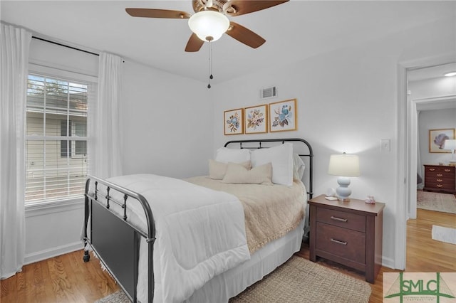 bedroom featuring ceiling fan and light wood-type flooring