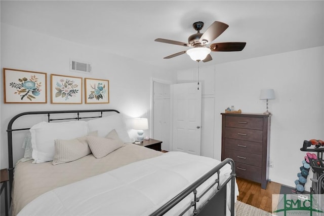 bedroom with ceiling fan and light hardwood / wood-style flooring