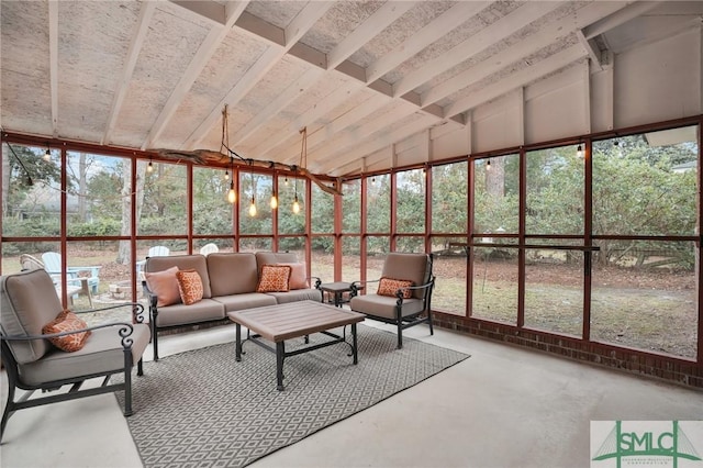 unfurnished sunroom featuring vaulted ceiling