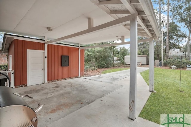 exterior space with a garage and an outbuilding