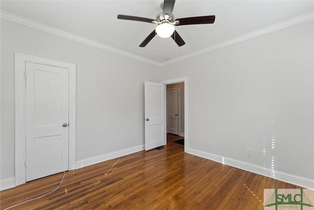 spare room featuring crown molding, hardwood / wood-style flooring, and ceiling fan