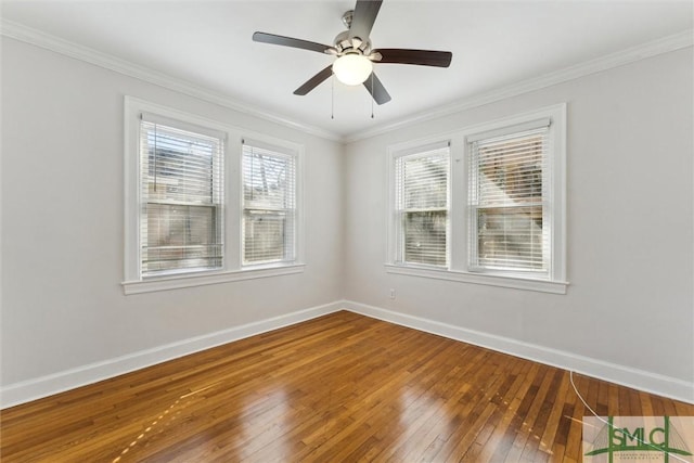 spare room with ceiling fan, ornamental molding, and hardwood / wood-style floors