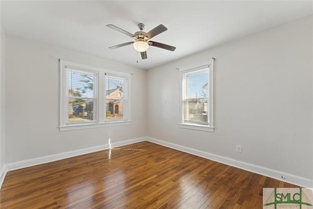 unfurnished room featuring dark hardwood / wood-style flooring and ceiling fan