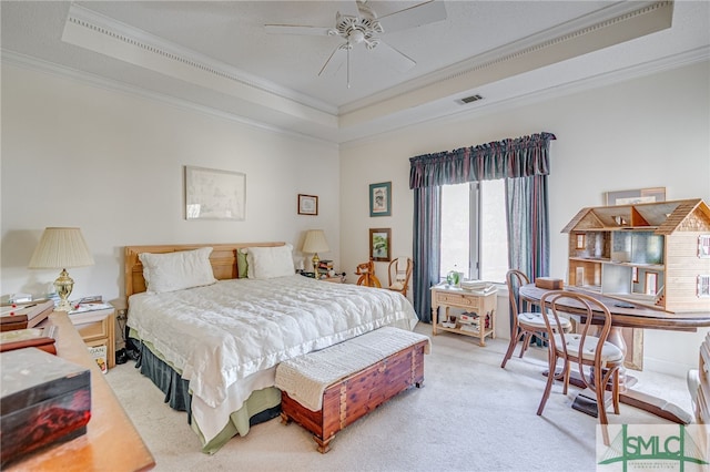 bedroom featuring light colored carpet, ornamental molding, and a raised ceiling