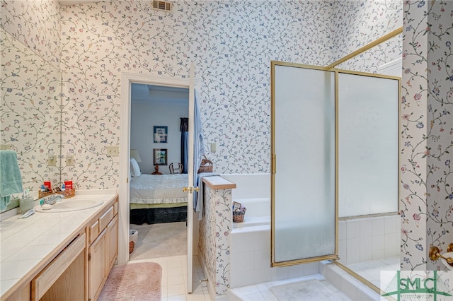 bathroom with vanity, tile patterned floors, and plus walk in shower