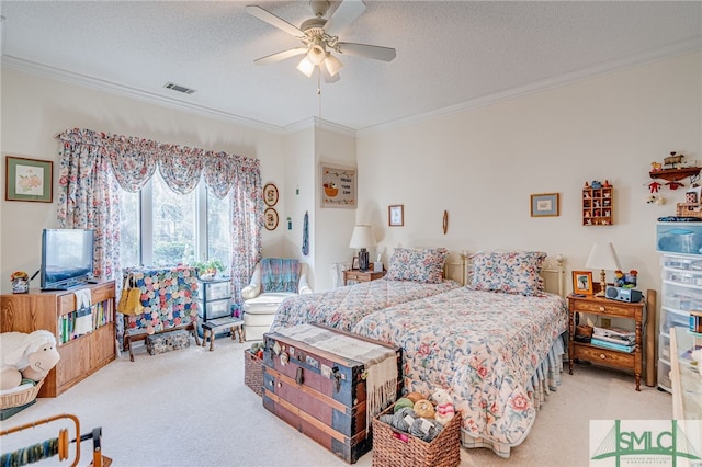 bedroom with ornamental molding and carpet