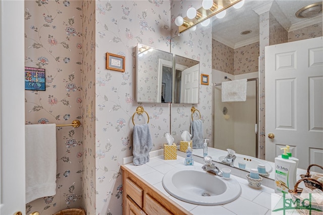 bathroom featuring crown molding, vanity, and a shower