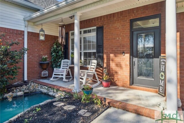 entrance to property with a porch