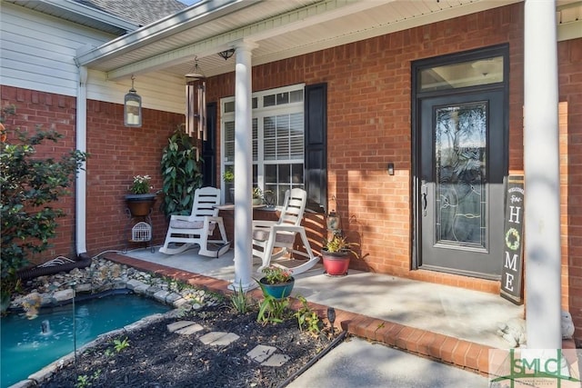 doorway to property featuring covered porch