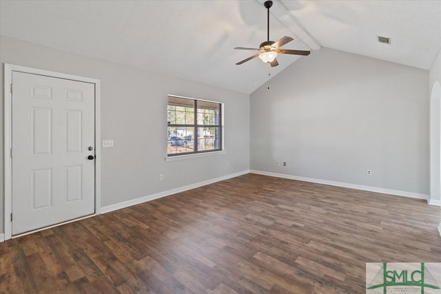 unfurnished living room with dark wood-type flooring, lofted ceiling with beams, and ceiling fan