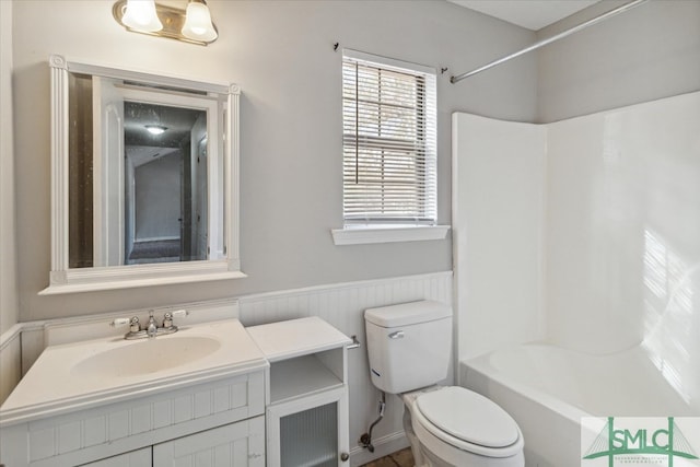 full bathroom featuring vanity, shower / washtub combination, and toilet