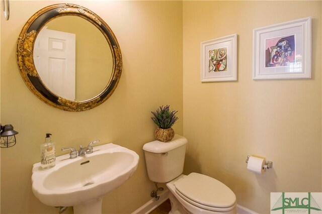 bathroom featuring sink and toilet