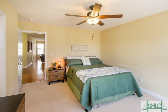 carpeted bedroom with ceiling fan