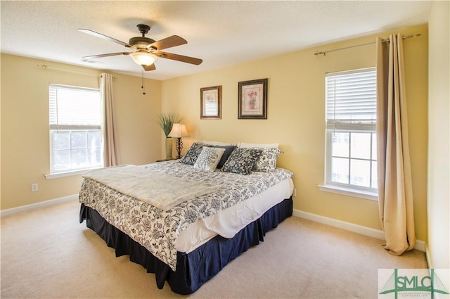 bedroom with light carpet and ceiling fan