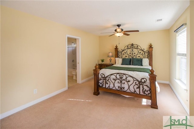 bedroom featuring carpet flooring, connected bathroom, and ceiling fan