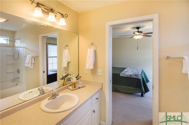 bathroom featuring shower / tub combination, vanity, and ceiling fan