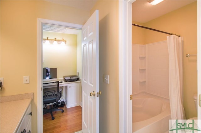 bathroom featuring vanity, shower / tub combo, and hardwood / wood-style floors