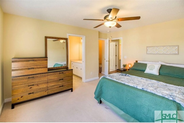 carpeted bedroom with connected bathroom and ceiling fan