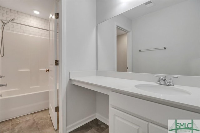 bathroom featuring vanity and tiled shower / bath