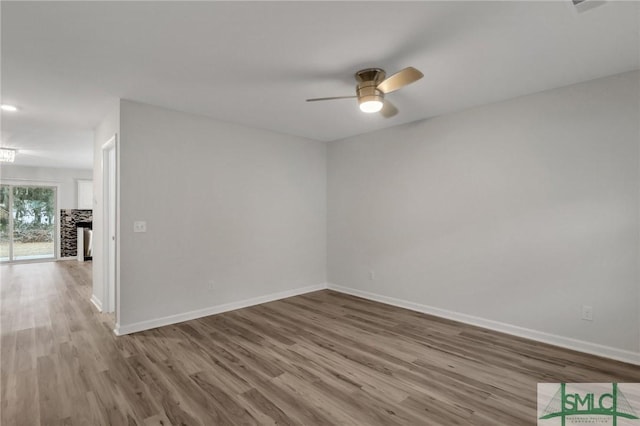 unfurnished room featuring ceiling fan and light wood-type flooring