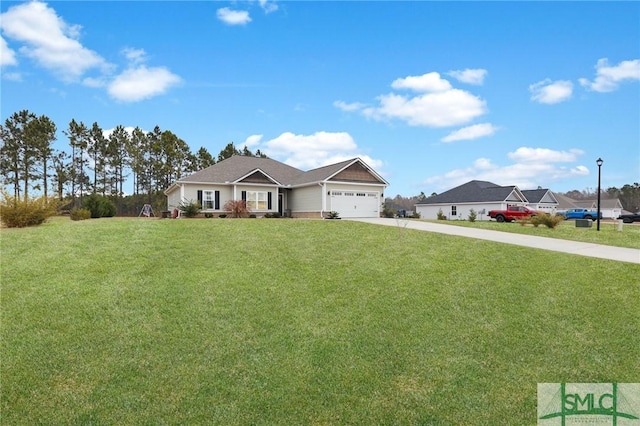 view of front of house featuring a garage and a front lawn