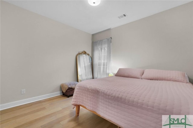 bedroom with light wood-type flooring