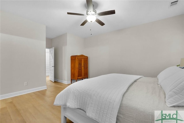 bedroom with ceiling fan and light wood-type flooring