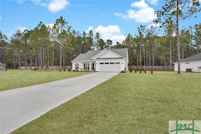 view of front of property with a garage and a front yard