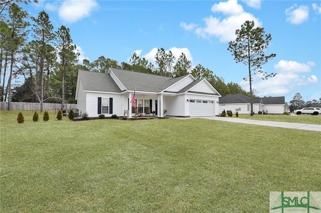 ranch-style house featuring a garage and a front lawn