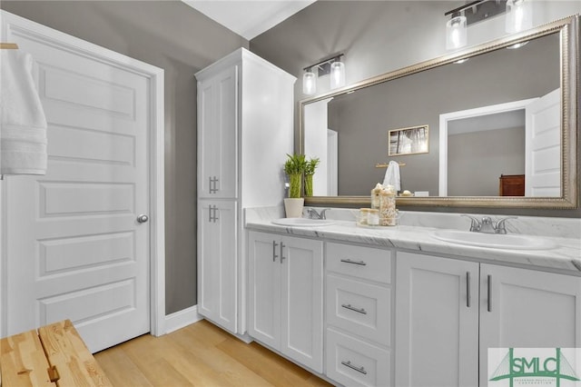 bathroom with vanity and hardwood / wood-style floors