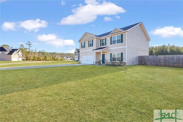 view of front of house with a garage and a front lawn