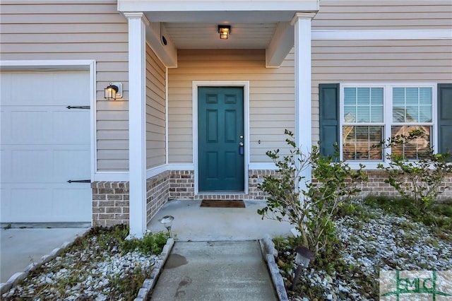 doorway to property featuring a garage