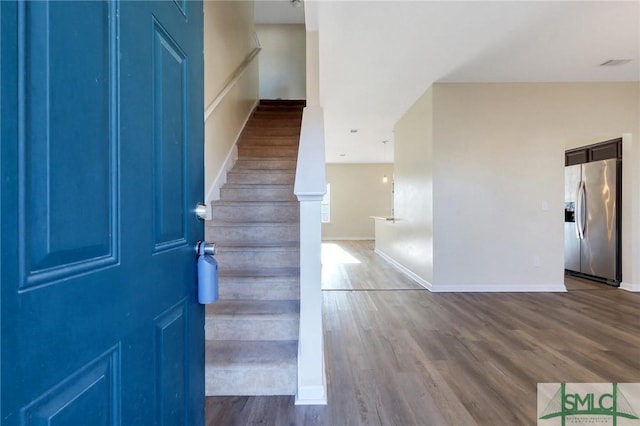 foyer entrance with hardwood / wood-style flooring