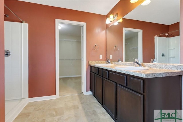 bathroom featuring vanity and walk in shower